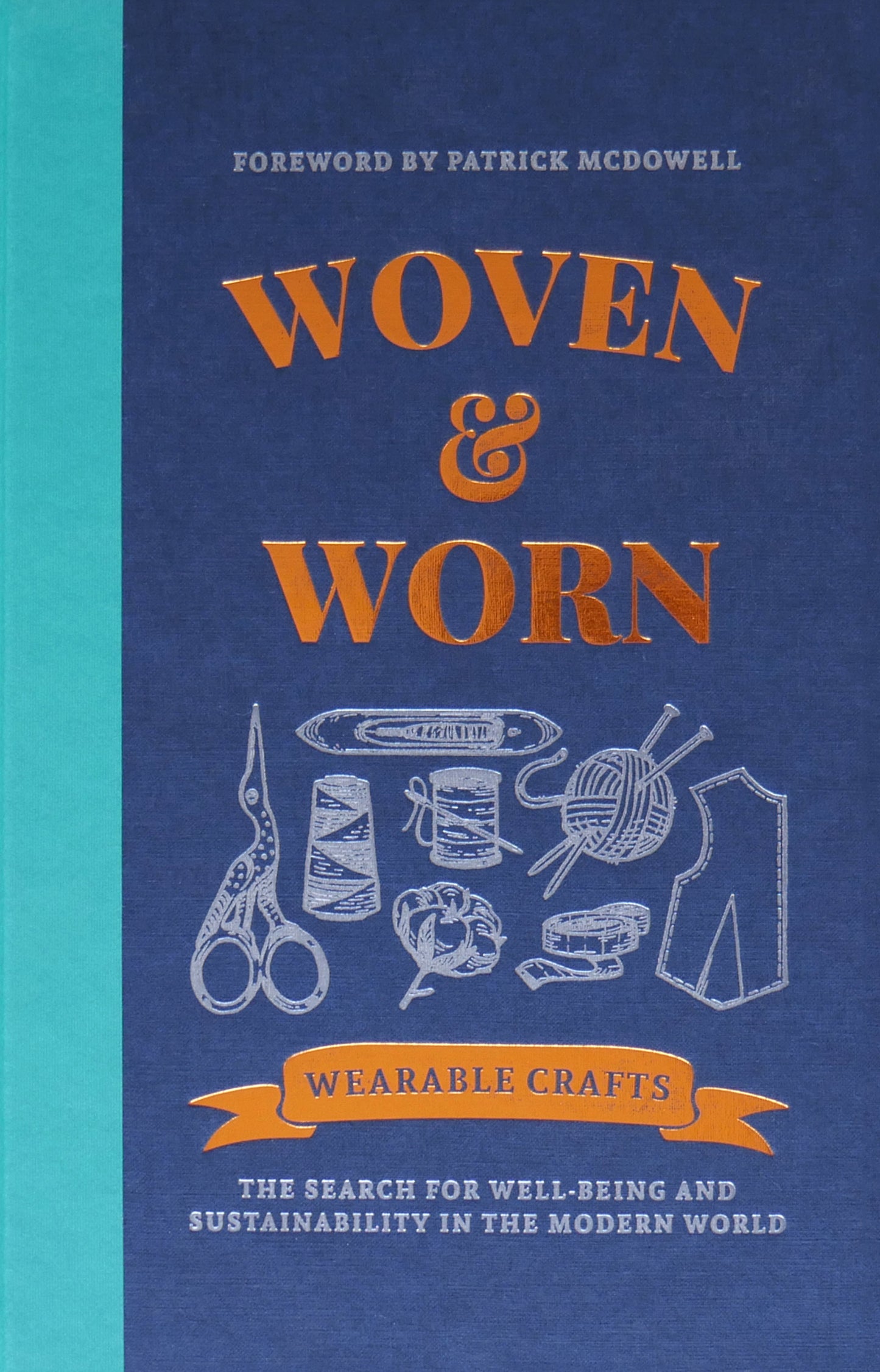 Blue 'Woven & Worn' book cover showing a variety of items for sewing, knitting, and making textiles, with title in gold font.